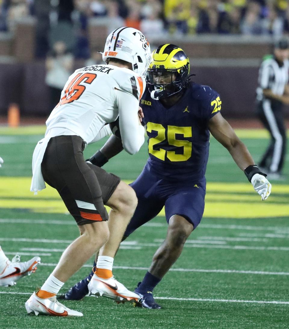 Michigan linebacker Junior Colson tackles Bowling Green quarterback Hayden Timosciek during the second half of Michigan's 31-6 win on Saturday, Sept. 16 2023, in Ann Arbor.