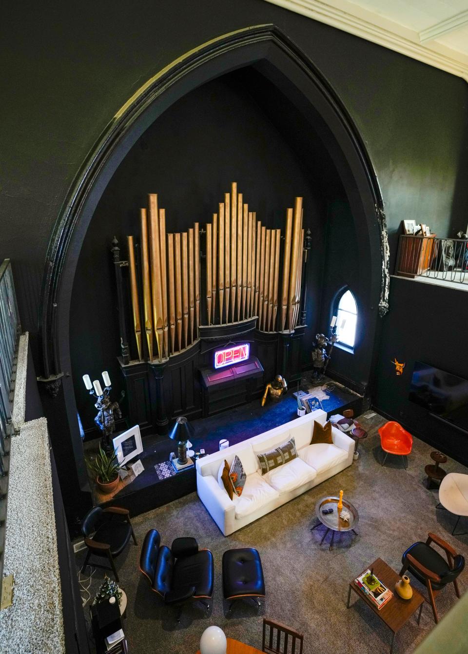 Organ pipes provide a backdrop in living room space after it the building was remodeled on York and Baymiller Streets in the West End. The church was built in 1866 and once housed the York Street Methodist Episcopal Church.