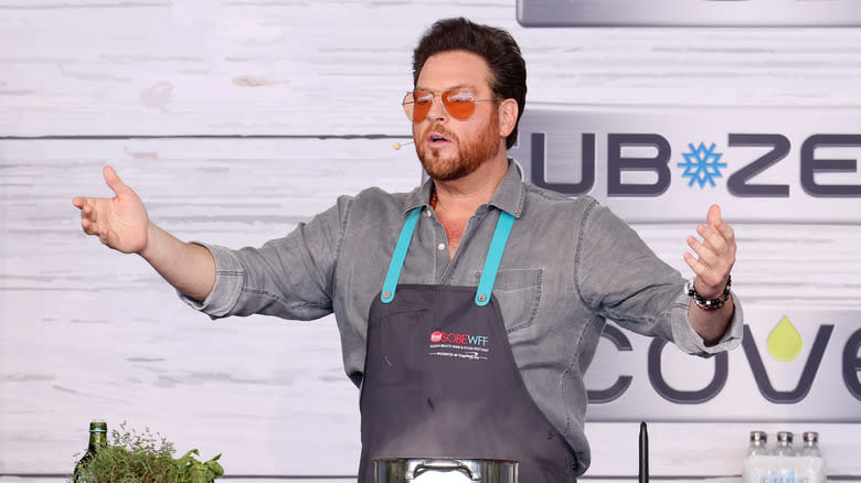 Scott Conant holds out his arms