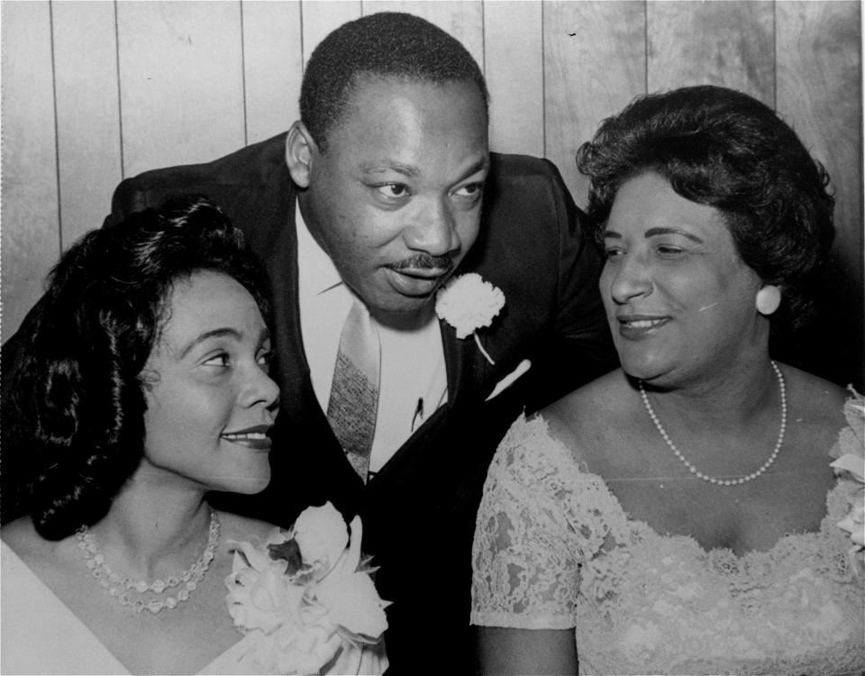 Dr. Martin Luther King, Jr., president of the Southern Christian Leadership Conference, chats with his wife, Coretta, left, and civil rights champion Constance Baker Motley before the start of an S.C.L.C. banquet in 1965 in Birmingham, Ala.