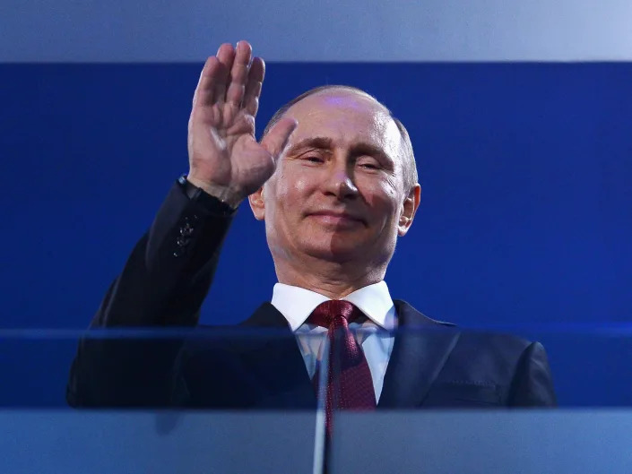 Russia President Vladimir Putin waves.