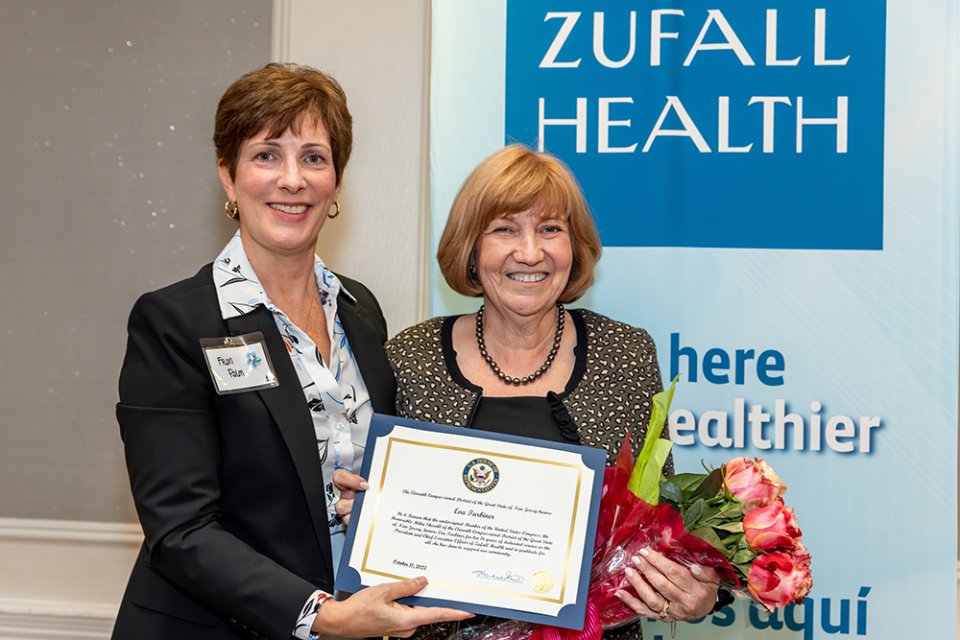 Zufall president and CEO Frances L. Palm, left, presents her predecessor Eva Turbiner with the Founders Award for her 16 years of leadership at Zufall.