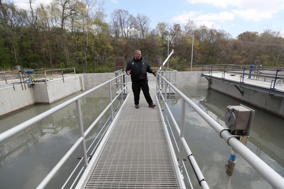 Steve Baytos IV, Akron Water Reclamation Facility superintendent, explains how the facility works as he stands over a pretreatment grit tank near the Headworks building at the Akron Water Reclamation Facility.