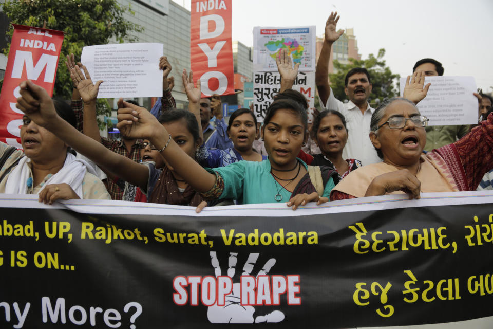 People shout slogans condemning rising cases of rape and violence against women during a protest in Ahmadabad, India, Monday, Dec. 2, 2019. Hundreds of people gathered in various Indian cities on Monday to demand justice in the case of a veterinarian who was gang-raped and killed last week. The burned body of the 27-year-old woman was found Thursday morning by a passer-by in an underpass in the southern city of Hyderabad after she went missing the previous night. (AP Photo/Ajit Solanki)