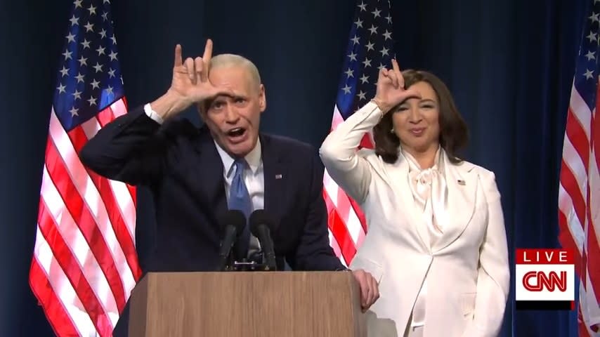 Jim Carrey as Joe Biden and Maya Rudolph as Kamala Harris making the Ace Ventura loser sign in "Saturday Night Live"