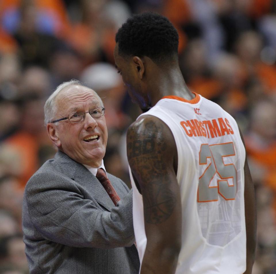 Syracuse’s head coach Jim Boeheim, left, talks with Rakeem Christmas late in the second half of an NCAA college basketball game against Pittsburgh in Syracuse, N.Y., Saturday, Jan. 18, 2014. Syracuse won 59-54. (AP Photo/Nick Lisi)