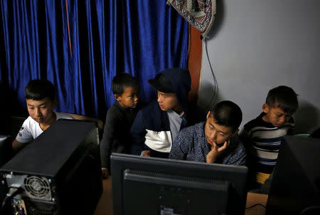 Youths gather in an internet gaming centre in the capital city of Thimphu, Bhutan, December 11, 2017. REUTERS/Cathal McNaughton