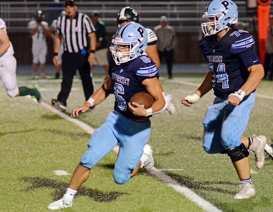 Petoskey's CJ Hibbler (6) has totaled nearly 250 yards the last couple of weeks, as the Northmen lean on the big guys up front more, like JD Cantrell (74) and others.