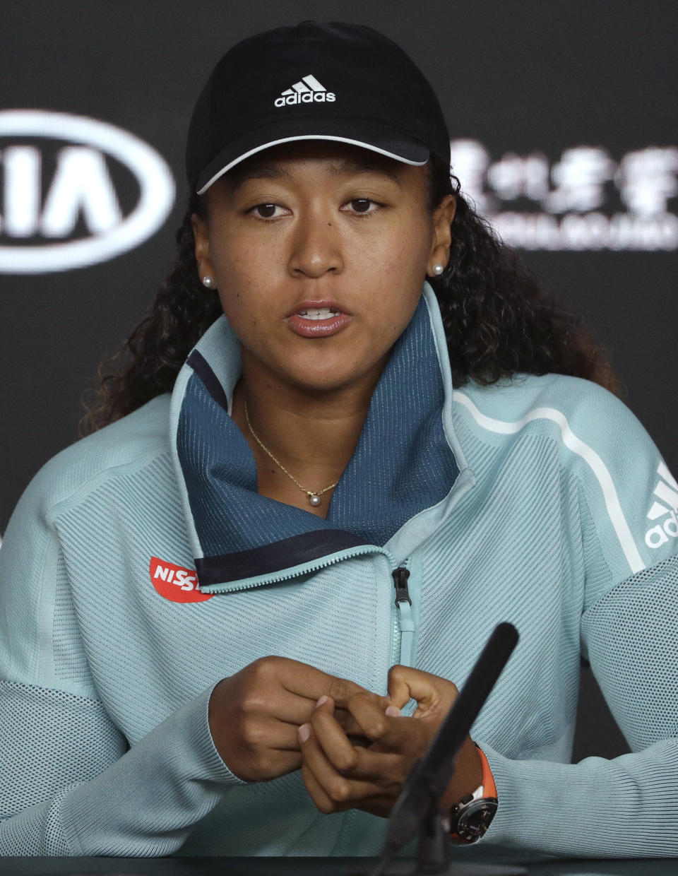 Japan's Naomi Osaka answers questions at a press conference following her win over Karolina Pliskova of the Czech Republic in their semifinal at the Australian Open tennis championships in Melbourne, Australia, Thursday, Jan. 24, 2019. (AP Photo/Mark Schiefelbein)