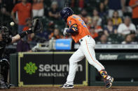 Houston Astros' Chas McCormick (20) is hit by a pitch with the bases loaded as Arizona Diamondbacks catcher Carson Kelly reaches for the ball during the 10th inning of a baseball game Friday, Sept. 17, 2021, in Houston. The Astros won 4-3. (AP Photo/David J. Phillip)