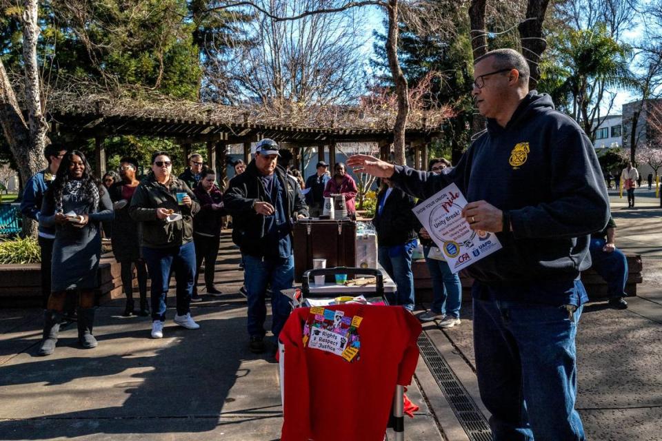 Matt Mason, an automotive service technician at Sacramento State and campus steward for Teamsters Local 2010 in Sacramento, speaks during campus rally last month in support of a stepped-based compensation structure for CSU workers.