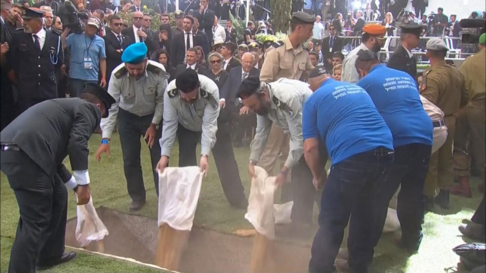 <p>A still image taken from a video shows personnel of the Israeli Defense Ministry pouring sand into the grave of former Israeli President Shimon Peres during his funeral ceremony at Mount Herzl Cemetery in Jerusalem on Sept. 30, 2016. (REUTERS/Pool via Reuters TV)</p>