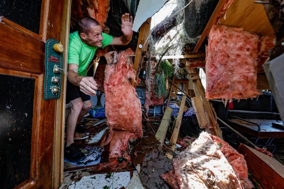Jeremy Harris, 51, inspects the mobile home he and his mother, Candace Dayton, 66, were sleeping in when a pine tree crashed into their kitchen at 9 AM during Hurricane Idalia at Perry Cove Mobile Home and RV Park in Perry, Florida on Wednesday, August 30, 2023.