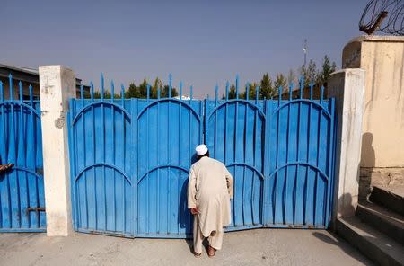 An Afghan man looks at the site of an attack at the American University of Afghanistan in Kabul, Afghanistan August 25, 2016. REUTERS/Mohammad Ismail