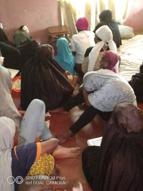 People sit in a room before being freed by police from an Islamic rehabilitation centre in Ibadan