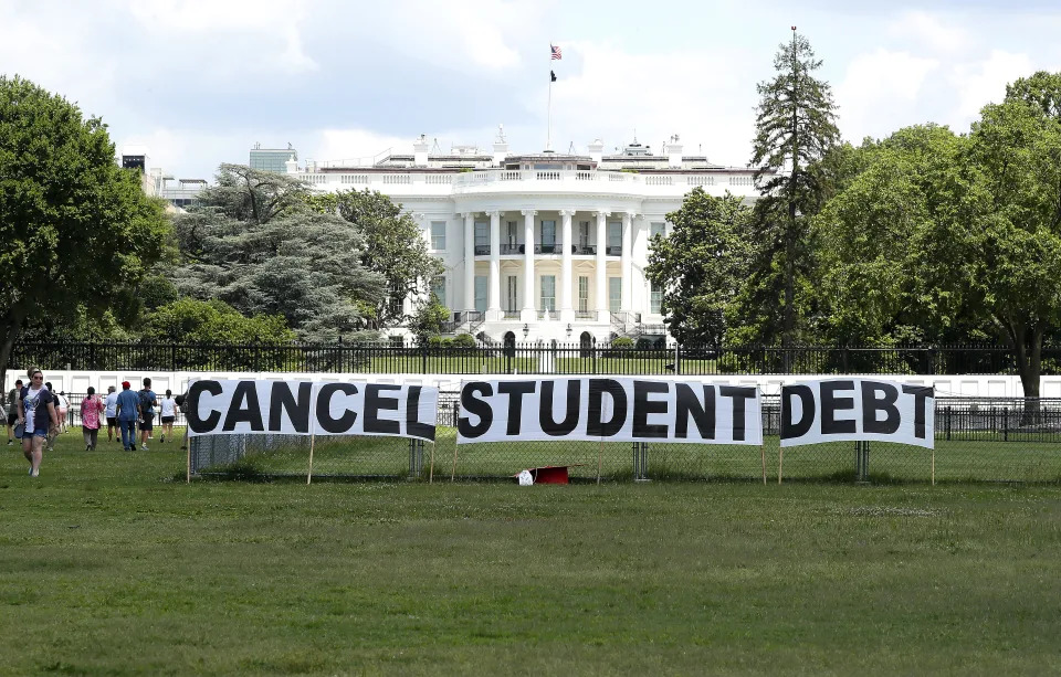 WASHINGTON, DC - JUNE 15: As college students around the country graduate with a massive amount of debt, advocates display a hand-painted sign on the Ellipse in front of The White House to call on President Joe Biden to sign an executive order to cancel student debt  on June 15, 2021 in Washington, DC.  (Photo by Paul Morigi/Getty Images for We The 45 Million)