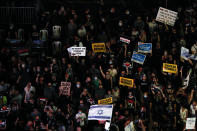 Protesters hold signs during a demonstration against Israel's government in Rabin square in Tel Aviv, Israel, Saturday, July 11, 2020. Thousands of Israelis gathered Saturday to protest the new government's failure to address economic woes brought by the coronavirus, directing their anger at Prime Minister Benjamin Netanyahu who is seeing his support plummeting. (AP Photo/Ariel Schalit)