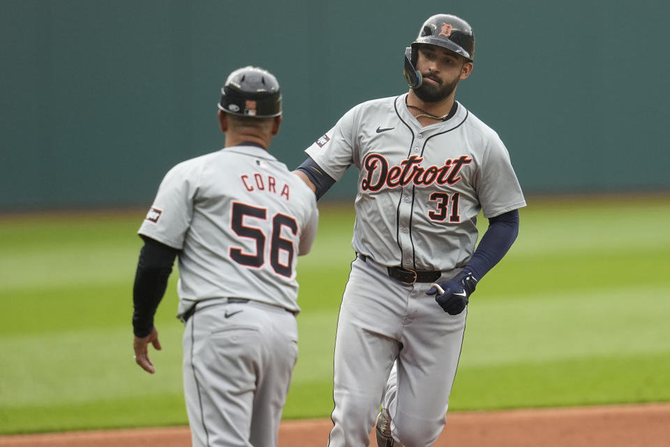 Detroit Tigers' Riley Greene (31) is congratulated by third base coach Joey Cora (56) as he runs home with a home run in the first inning of a baseball game against the Cleveland Guardians, Monday, May 6, 2024, in Cleveland. (AP Photo/Sue Ogrocki)