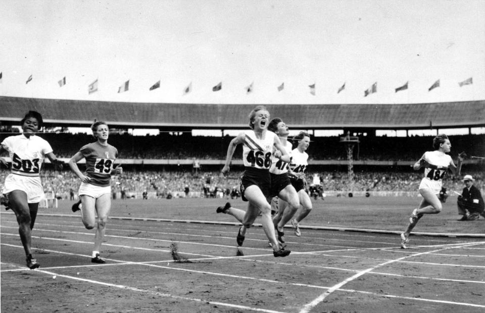 FILE - In this Nov. 26, 1956, file photo, Betty Cuthbert (468) of Australia runs past the finish line to win the women's Olympic 100 meters in Melbourne, Australia. (AP Photo)