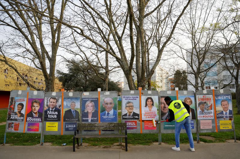 French presidential election candidates posters are pasted on electoral panels in Saint-Herblain