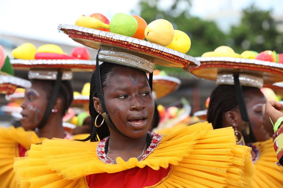 A performer walks through the street during Lagos Carnival in Lagos, Nigeria, Monday, April 1, 2013. Performers filled the streets of Lagos' islands Monday as part of the Lagos Carnival, a major festival in Nigeria's largest city during Easter weekend. (AP Photo/Sunday Alamba)