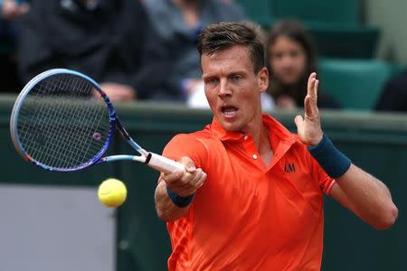 Tomas Berdych of the Czech Republic plays a shot to Yoshihito Nishioka of Japan during their men's singles match at the French Open tennis tournament at the Roland Garros stadium in Paris, France, May 25, 2015. REUTERS/Pascal Rossignol