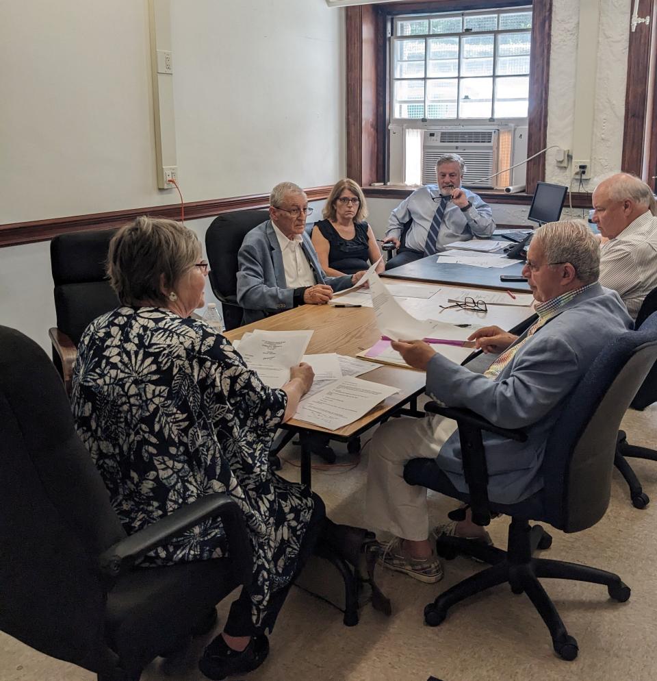 Newport Canvassing Authority board chair Sharon Connor, front left, leads a Canvassing Authority meeting at Newport City Hall on Wednesday.