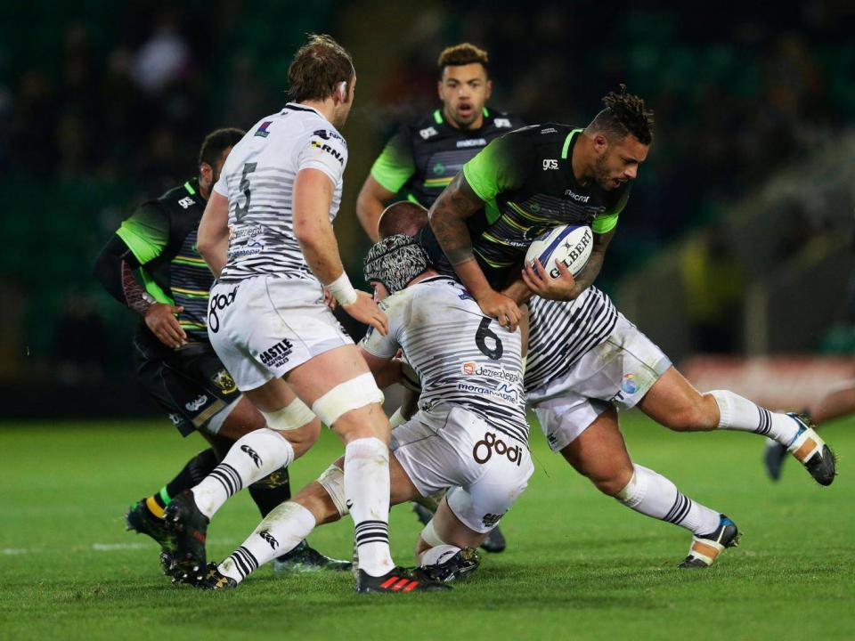 Courtney Lawes is brought down by Dan Lydiate (Getty)