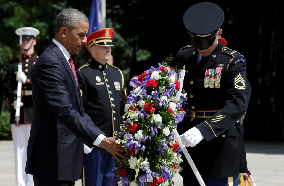 <p>President Obama lays a wreath at the Tomb of the Unknown Soldier during the Memorial Day observance at Arlington National Cemetery on May 30, 2016. (Photo: Yuri Gripas/Reuters) </p>