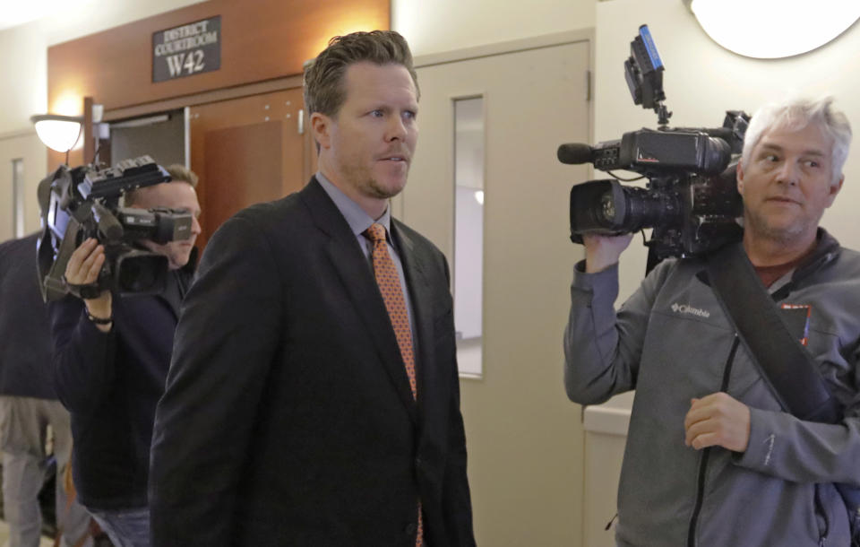 Paul Petersen, an Arizona elected official accused of running a multi-state adoption scheme, leaves court following an initial appearance on charges filed in the state Friday, Nov. 15, 2019, in Salt Lake City. Prosecutors in three states say Petersen brought pregnant women from the Marshall Islands to the United States and paid them to give up their babies for adoption. He's pleaded not guilty. (AP Photo/Rick Bowmer)