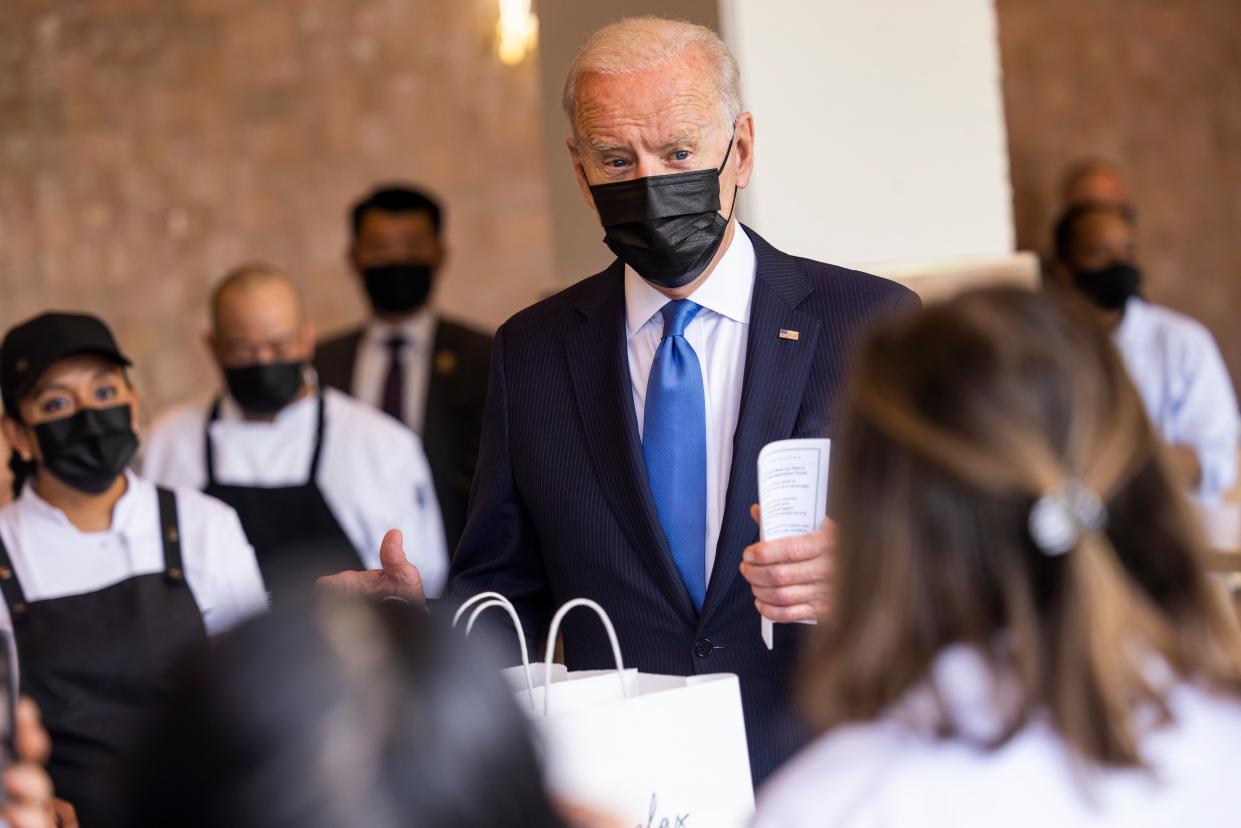 <p>Joe Biden visits Taqueria Las Gemelas in Washington DC on 5 May, among one of the first restaurants to receive funds from a $28.6bn relief programme.</p> (EPA)