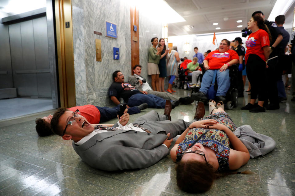 <p>Demonstrators like on the ground as the Senate Finance Committee holds a hearing on the latest Republican Effort to repeal and replace the Affordable Care Act on Capitol Hill in Washington, U.S. September 25, 2017. (Photo: Aaron P. Bernstein/Reuters) </p>