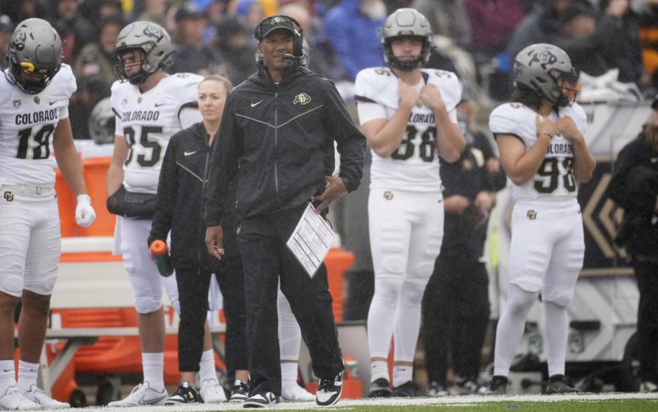 Colorado coach Karl Dorrell watches from the sideline as his team plays Air Force.