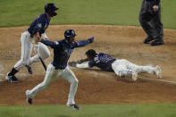 Tampa Bay Rays' Randy Arozarena celebrates after scoring the winning run in Game 4 of the baseball World Series against the Los Angeles Dodgers Saturday, Oct. 24, 2020, in Arlington, Texas. Rays defeated the Dodgers 8-7 to tie the series 2-2 games. (AP Photo/Sue Ogrocki)