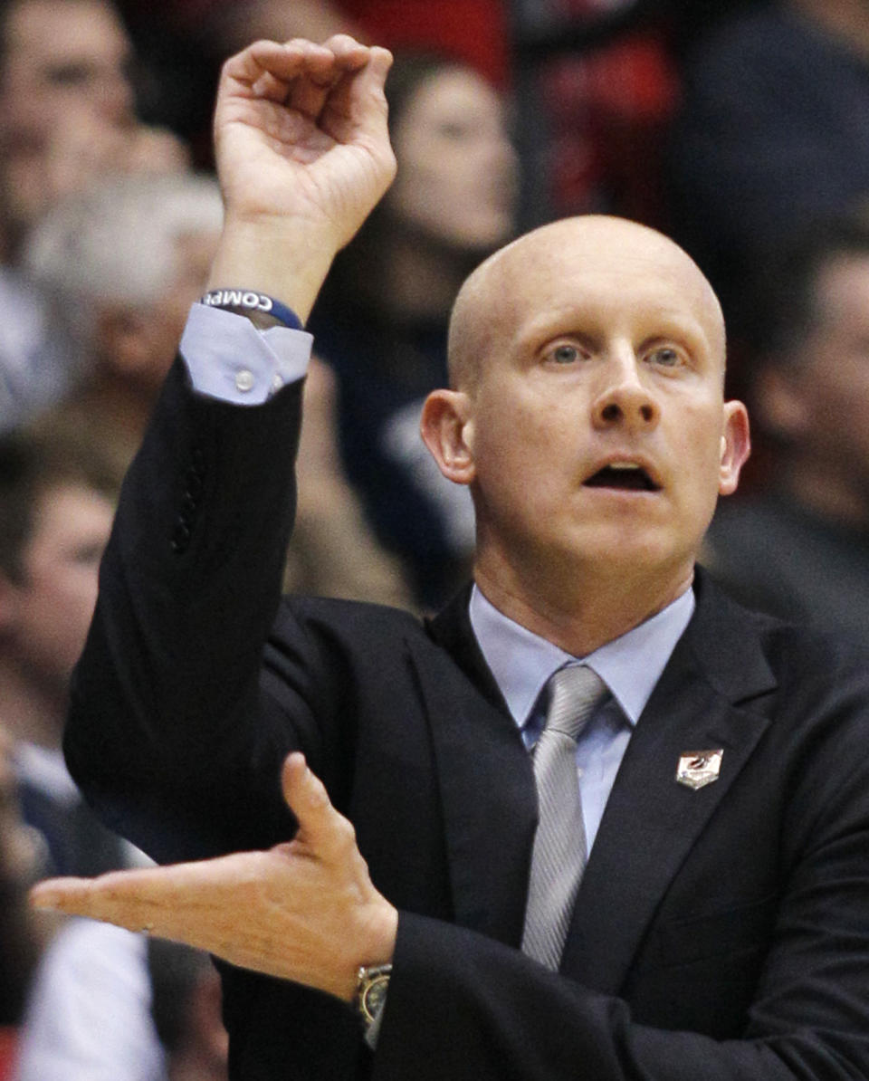 Xavier coach Chris Mack calls a play against North Carolina State during the first half of a first-round game of the NCAA college basketball tournament, Tuesday, March 18, 2014, in Dayton, Ohio. (AP Photo/Skip Peterson)