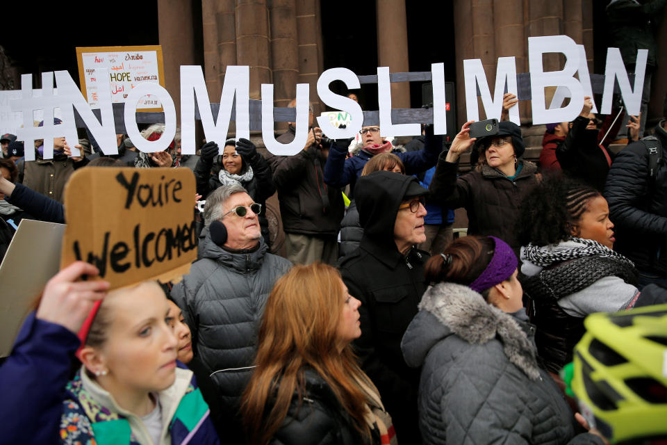 Demonstrators spell out "# No Muslim Ban" during the protest in Boston.&nbsp;