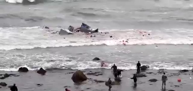 This screengrab of video obtained by CBS News shows the ship breaking apart in choppy waters off the coast of San Diego on Sunday, May 2, 2021. 