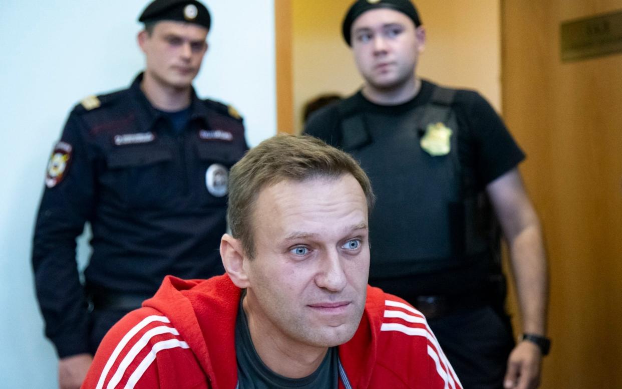 Alexei Navalny is suing the Kremlin spokesman for his claims that he has been working for CIA agents - Alexander Zemlianichenko/AP