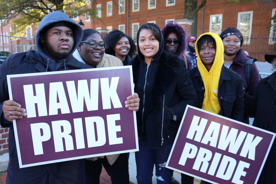 Vernon Johnson, left, a sophomore at the University of Maryland Eastern Shore, holds a sign at a rally in Annapolis, Maryland, with other students on Wednesday, Nov. 13, 2019 in support of efforts to settle a federal lawsuit that is more than a decade old involving the state's four historically black colleges. A federal judge found in 2013 that the state maintained "a dual and segregated education system" that violated the Constitution. (AP Photo/Brian Witte)