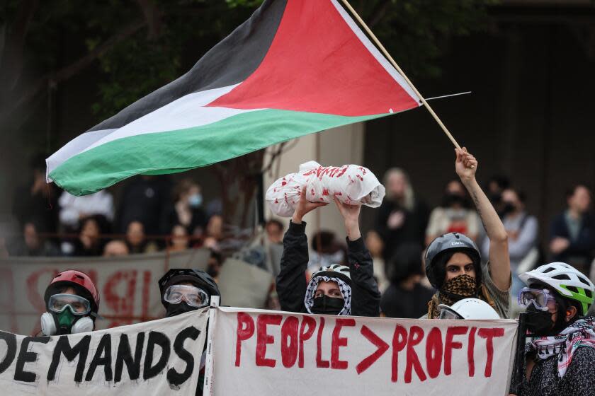 Irvine, CA, Wednesday, May 15, 2024 - Scores of law enforcement personnel from various agencies move hundreds of demonstrating students, faculty and supporters protesting the treatment of Palestinians and the UC system's investments in Isreali interests. (Robert Gauthier/Los Angeles Times)