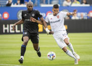 CF Montreal's Kamal Miller, left, challenges Real Salt Lake's Maikel Chang during the second half of an MLS soccer game in Montreal, Sunday, May 22, 2022. (Graham Hughes/The Canadian Press via AP)