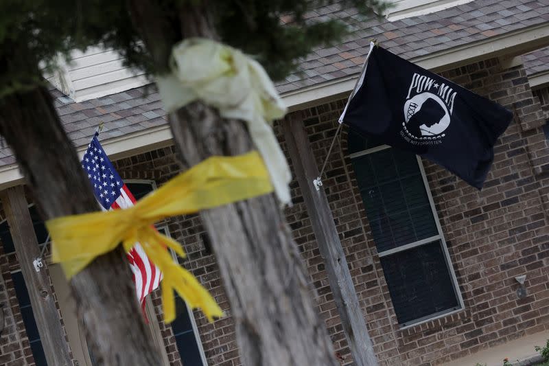 A POW-MIA flag flies outside the family home of former U.S. Marine Trevor Reed, in Granbury