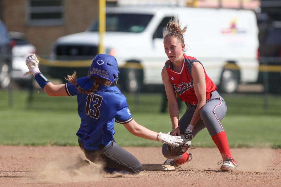 Crestwood junior shortstop Aimee Barnauskas makes a play on Gilmour Academy’s Lauren Riccobelli as she steals second base during Tuesday’s state tournament game at Crestwood High School.