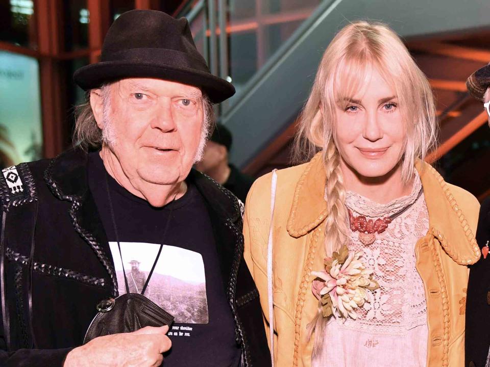 <p>Sarah Morris/Getty</p> Neil Young and Daryl Hannah
