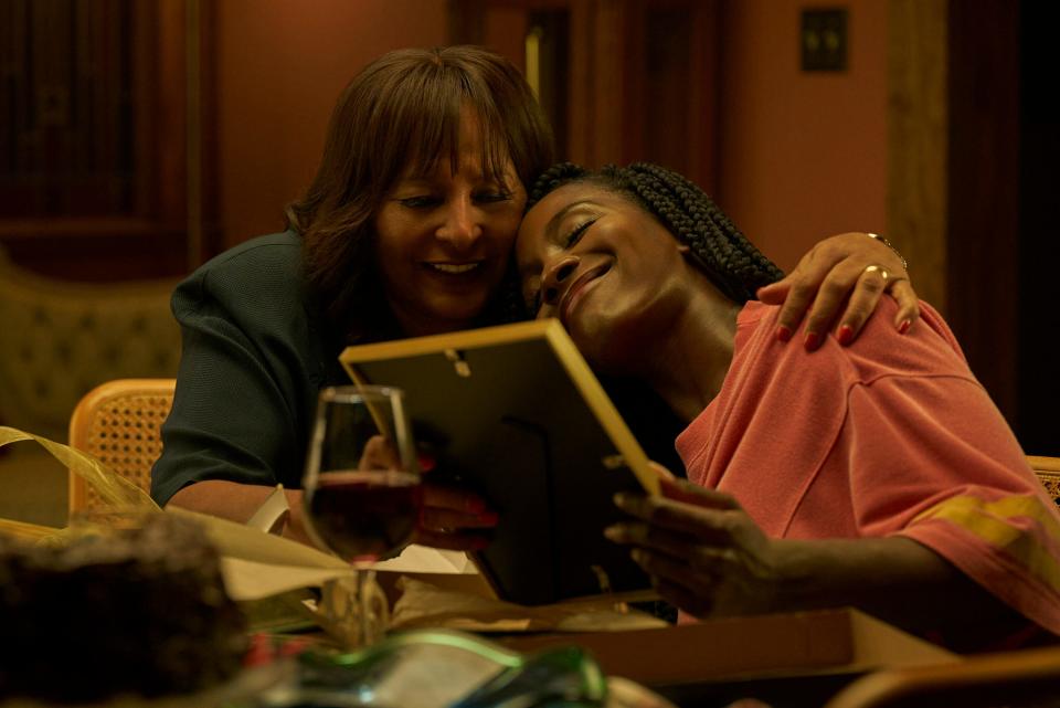 Athena (Pam Grier, left) is the caring mom of LAPD homicide detective Dawn (Deborah Ayorinde) in the streaming horror series "Them: The Scare."