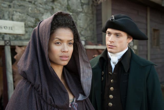 <p>Dj/Isle Of Man/Bfi/Pinewood/Kobal/Shutterstock </p> Gugu Mbatha-Raw and Sam Reid in 'Belle,' 2013.