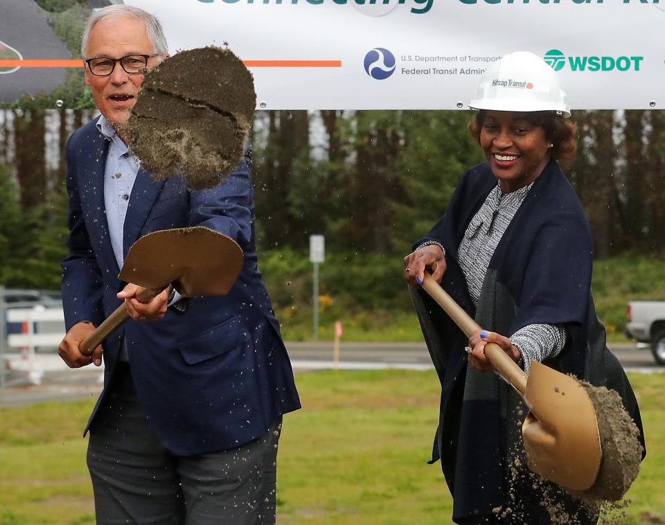 Gov. Jay Inslee and Federal Transportation Administration head Nuria Fernandez take part in the ceremonial groundbreaking for Kitsap Transit's Silverdale Transit Center located off of Ridgetop Boulevard on Thursday.