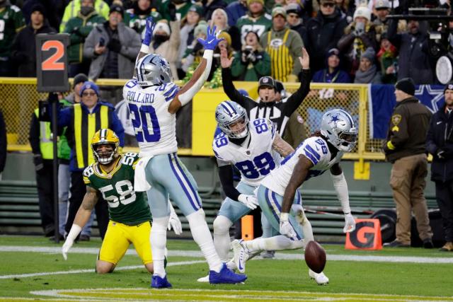Dallas Cowboys wide receiver CeeDee Lamb (88), Tony Pollard, and Peyton Hendershot (89) celebrate in front o Green Bay Packers linebacker Isaiah McDuffie (58) after Lamb scored a touchdown during Sunday’s game.