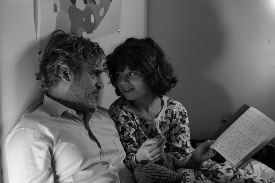 Joaquin Phoenix, left, plays uncle to Woody Norman in Mike Mills' "C'mon C'mon."