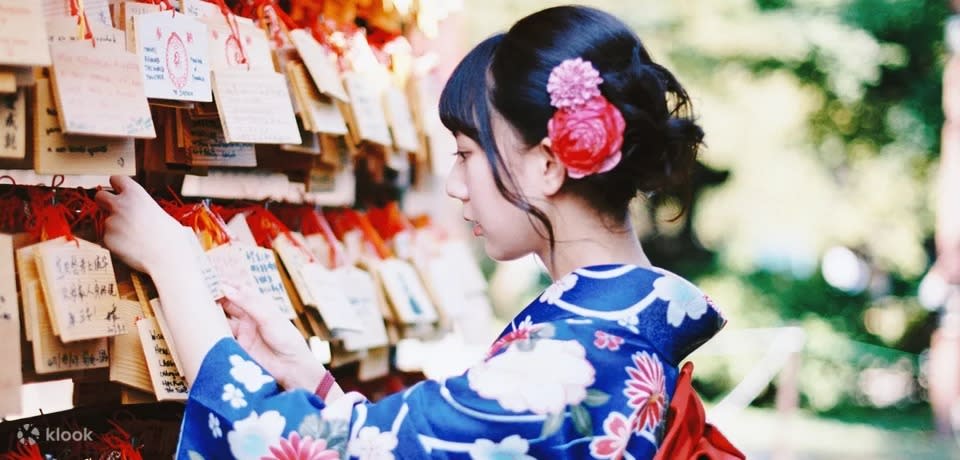 A photo of a woman in a kimono.